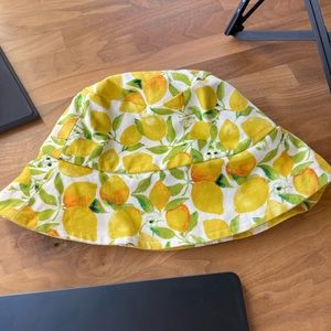 Positano lemon bucket hat from C B boutique. 100% cotton and hand-made in Italy